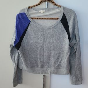 Crop sweater with mesh detail.